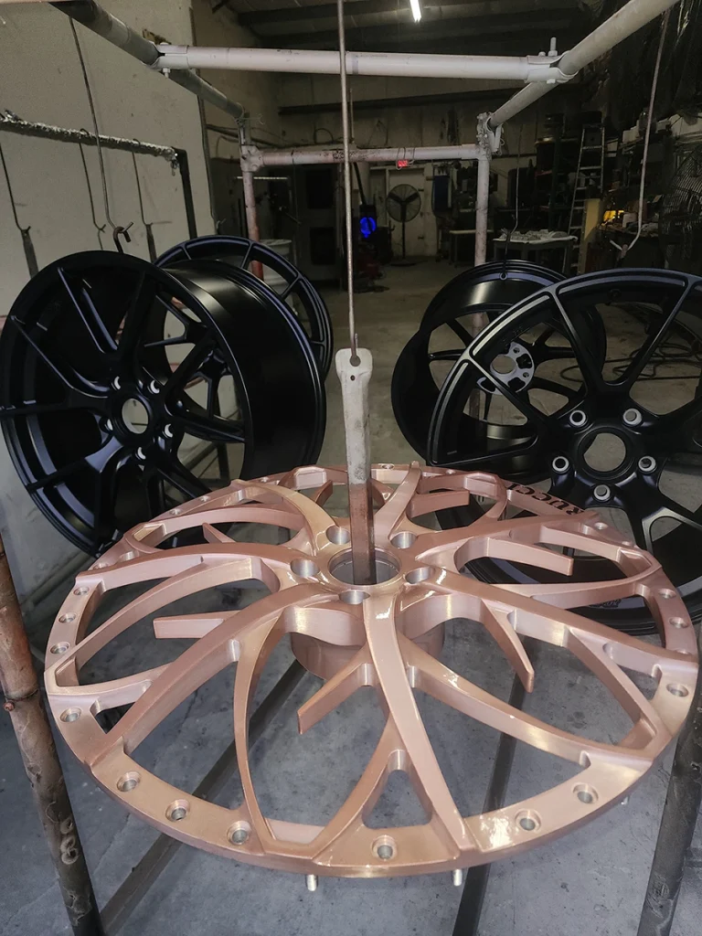 Black and rose-colored wheels arranged in the shop