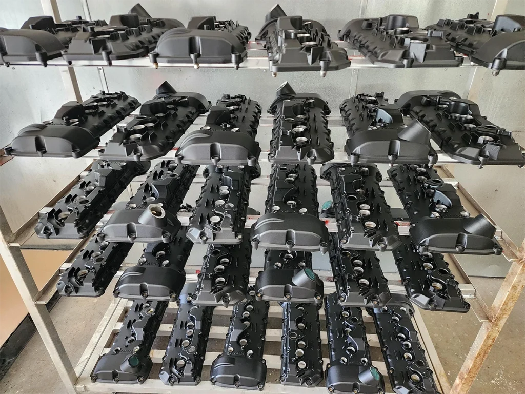 Rows of fabricated metal assemblies on work tables